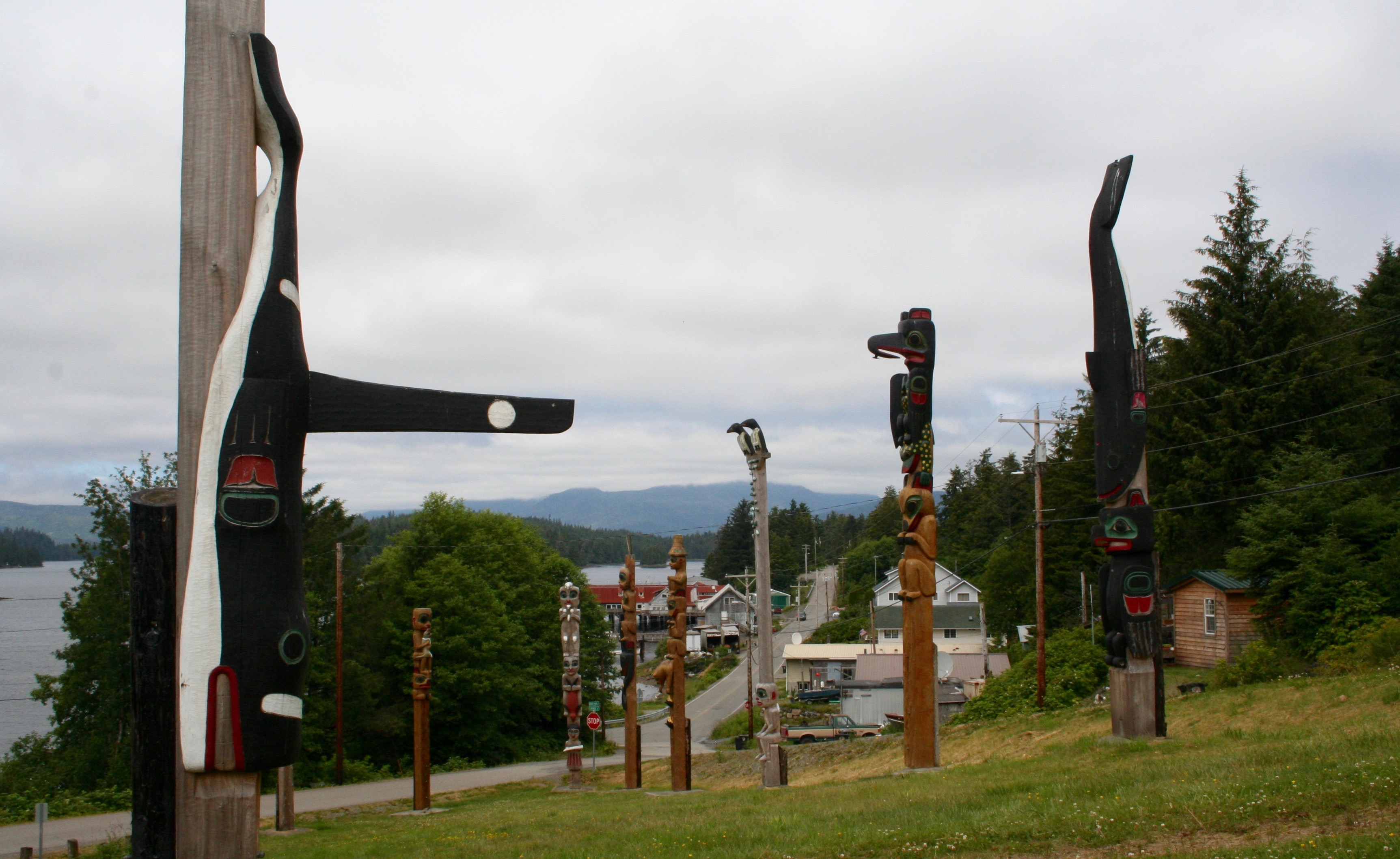 From the Tlingit village of Kwalock, a diversity of poles look out over the water.